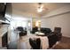 Spacious living room with fireplace, open to dining area at 9067 Bob Jackson Dr, Jonesboro, GA 30238