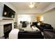 Open-concept living room with fireplace flows into the dining area and kitchen at 9067 Bob Jackson Dr, Jonesboro, GA 30238