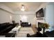 Comfortable living room with fireplace, ample seating, and views of the entryway at 9067 Bob Jackson Dr, Jonesboro, GA 30238
