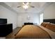 Spacious main bedroom featuring a tray ceiling, and neutral decor at 9067 Bob Jackson Dr, Jonesboro, GA 30238