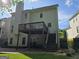 View of the back of the house with a deck and brick patio at 3773 Summer Rose Dr, Atlanta, GA 30341