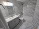 Bathroom featuring a modern vanity, toilet, and bathtub with gray and white tiling at 3773 Summer Rose Dr, Atlanta, GA 30341
