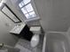 Bathroom featuring a black vanity, toilet and shower and bathtub combination and a window to allow natural light at 3773 Summer Rose Dr, Atlanta, GA 30341