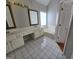 Bright bathroom featuring a double vanity, garden tub, and classic tile flooring for a timeless appeal at 3773 Summer Rose Dr, Atlanta, GA 30341