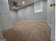 Bedroom with a brown carpet, ceiling fan, and single window for natural lighting at 3773 Summer Rose Dr, Atlanta, GA 30341