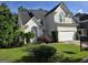 Beautiful two-story home with a well-manicured lawn and attached garage at 3773 Summer Rose Dr, Atlanta, GA 30341