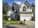 Charming stucco two-story home with well-manicured lawn and attached two-car garage at 3773 Summer Rose Dr, Atlanta, GA 30341