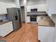 Spacious kitchen with stainless steel refrigerator, oven, and ample cabinet space at 3773 Summer Rose Dr, Atlanta, GA 30341