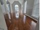 Open living room with hardwood floors, arch top window and natural light at 3773 Summer Rose Dr, Atlanta, GA 30341