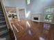 Spacious living room featuring hardwood flooring, fireplace, and open access to the kitchen at 3773 Summer Rose Dr, Atlanta, GA 30341