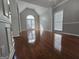 Bright living room with hardwood floors, tall ceilings and neutral wall color at 3773 Summer Rose Dr, Atlanta, GA 30341