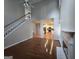 Bright living room features fireplace, hardwood flooring, high ceilings, and access to kitchen at 3773 Summer Rose Dr, Atlanta, GA 30341