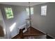 Spacious living room view from above features fireplace and lots of natural light from large windows at 3773 Summer Rose Dr, Atlanta, GA 30341
