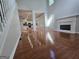 Open floor plan flows into kitchen, offering a fireplace, hardwood flooring, and great natural light at 3773 Summer Rose Dr, Atlanta, GA 30341