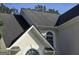 A close-up of the roof and arched window detailing of this home at 3773 Summer Rose Dr, Atlanta, GA 30341
