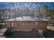 Brick home exterior featuring well-maintained yard and landscaping at 1684 Lake Harbin Rd, Morrow, GA 30260