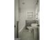 Clean bathroom featuring a new toilet and pedestal sink at 1684 Lake Harbin Rd, Morrow, GA 30260
