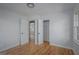 Bedroom with closets featuring hardwood floors and natural light at 1684 Lake Harbin Rd, Morrow, GA 30260