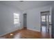 Bedroom featuring hardwood floors, neutral paint, closet, and natural light at 1684 Lake Harbin Rd, Morrow, GA 30260