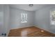 Bright bedroom featuring hardwood floors and plenty of natural light at 1684 Lake Harbin Rd, Morrow, GA 30260