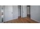 Bright bedroom features hardwood floors, closet, and neutral paint at 1684 Lake Harbin Rd, Morrow, GA 30260