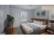Comfortable bedroom with a large bed, a nightstand, a dresser, and ample natural light at 1684 Lake Harbin Rd, Morrow, GA 30260
