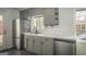Modern kitchen featuring stainless steel appliances and gray cabinets at 1684 Lake Harbin Rd, Morrow, GA 30260
