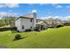 Spacious backyard with lush green lawn, covered patio, and well-maintained landscaping at 465 Harris Dr, Conyers, GA 30012