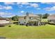 Expansive backyard featuring a well-maintained lawn and a charming patio at 465 Harris Dr, Conyers, GA 30012