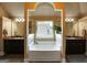 Inviting bathroom with a soaking tub framed by dual vanities and a large window at 465 Harris Dr, Conyers, GA 30012