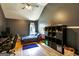 Well-lit bedroom featuring wood floors, storage, and a comfortable bed at 465 Harris Dr, Conyers, GA 30012