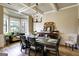 Elegant dining room featuring coffered ceilings, bay window, and a stylish chandelier at 465 Harris Dr, Conyers, GA 30012