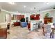 Large open-concept kitchen features dark wood cabinets, a kitchen island, breakfast bar and tile floors at 465 Harris Dr, Conyers, GA 30012