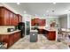 Well-equipped kitchen featuring dark wood cabinets, granite countertops, and stainless steel appliances at 465 Harris Dr, Conyers, GA 30012