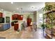 Spacious kitchen boasts a breakfast bar, dark wood cabinets, tile floors, and an eat-in nook at 465 Harris Dr, Conyers, GA 30012