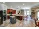 Spacious kitchen features cherry cabinets, granite counters, kitchen island, and sunlit breakfast nook at 465 Harris Dr, Conyers, GA 30012