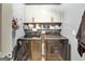 Functional laundry room with modern washer and dryer units and overhead cabinet storage at 465 Harris Dr, Conyers, GA 30012