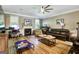 Cozy living room with hardwood floors, fireplace, and plenty of natural light at 465 Harris Dr, Conyers, GA 30012