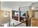 Inviting living room showcases an open floorplan with a charming chandelier and wrought iron railing at 465 Harris Dr, Conyers, GA 30012