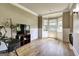 Inviting living room with natural light, a bay window, and neutral color palette at 465 Harris Dr, Conyers, GA 30012