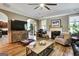Living room features a fireplace, hardwood floors, and stylish furnishings at 465 Harris Dr, Conyers, GA 30012