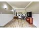 Spacious living room with wood-look floors, neutral walls, and decorative wainscoting at 465 Harris Dr, Conyers, GA 30012