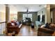Comfortable living room features a stylish ceiling fan, a computer, and ample seating at 465 Harris Dr, Conyers, GA 30012