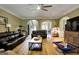 Spacious living room features hardwood floors, multiple sofas, and open floorplan at 465 Harris Dr, Conyers, GA 30012