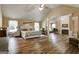 Expansive main bedroom has wood floors, vaulted ceiling, and sun-filled windows at 465 Harris Dr, Conyers, GA 30012