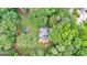 Secluded aerial view of a private home nestled among lush green trees at 135 Birdsong Ln, Fayetteville, GA 30215