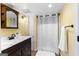 Bathroom featuring modern sink and vanity with a shower/tub combo with white shower curtain at 135 Birdsong Ln, Fayetteville, GA 30215
