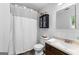 Bathroom featuring a shower with a curtain, toilet, and single sink vanity at 135 Birdsong Ln, Fayetteville, GA 30215