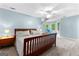 Spacious bedroom with plenty of natural light, carpet floors, and a ceiling fan at 135 Birdsong Ln, Fayetteville, GA 30215