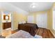 Comfortable bedroom features wood floors, an area rug and two closets for ample storage at 135 Birdsong Ln, Fayetteville, GA 30215